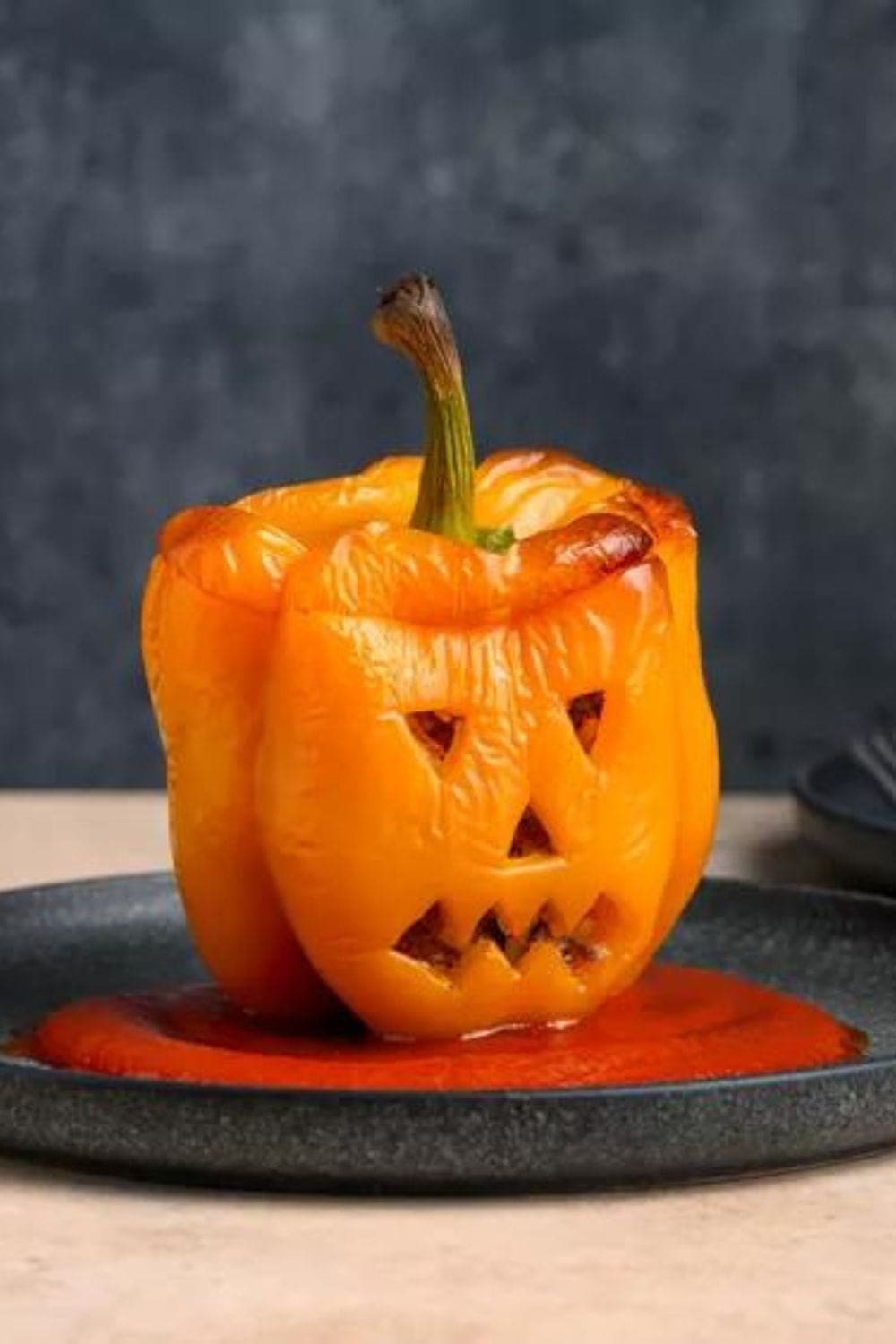 Jack-O&rsquo;-Lantern Stuffed Peppers